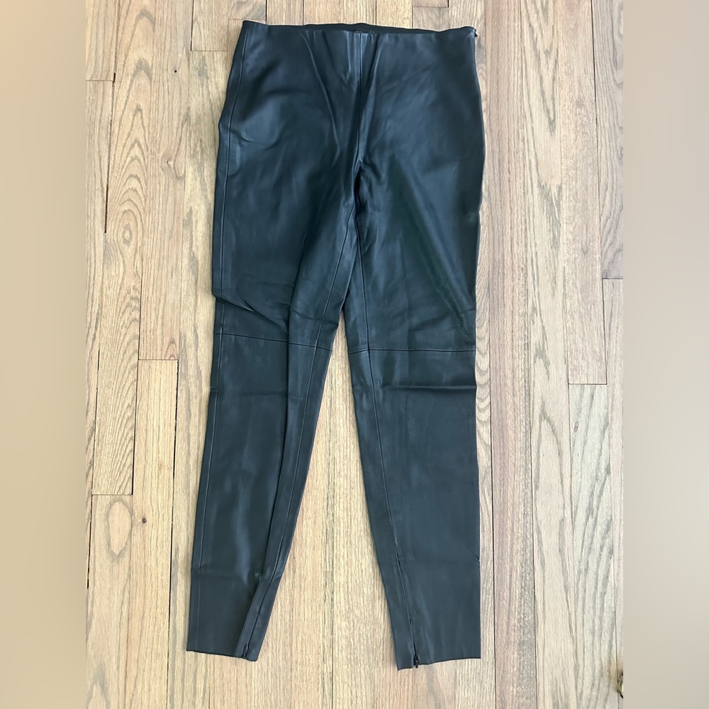Black elastic waistband and side zip faux leather Zara pants. Size Medium.